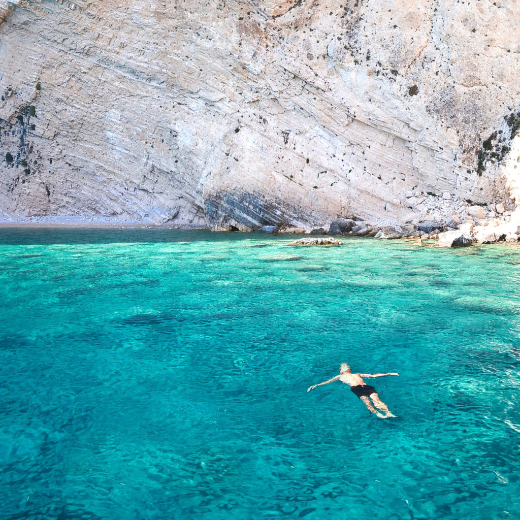 Person Floating In Open Water 